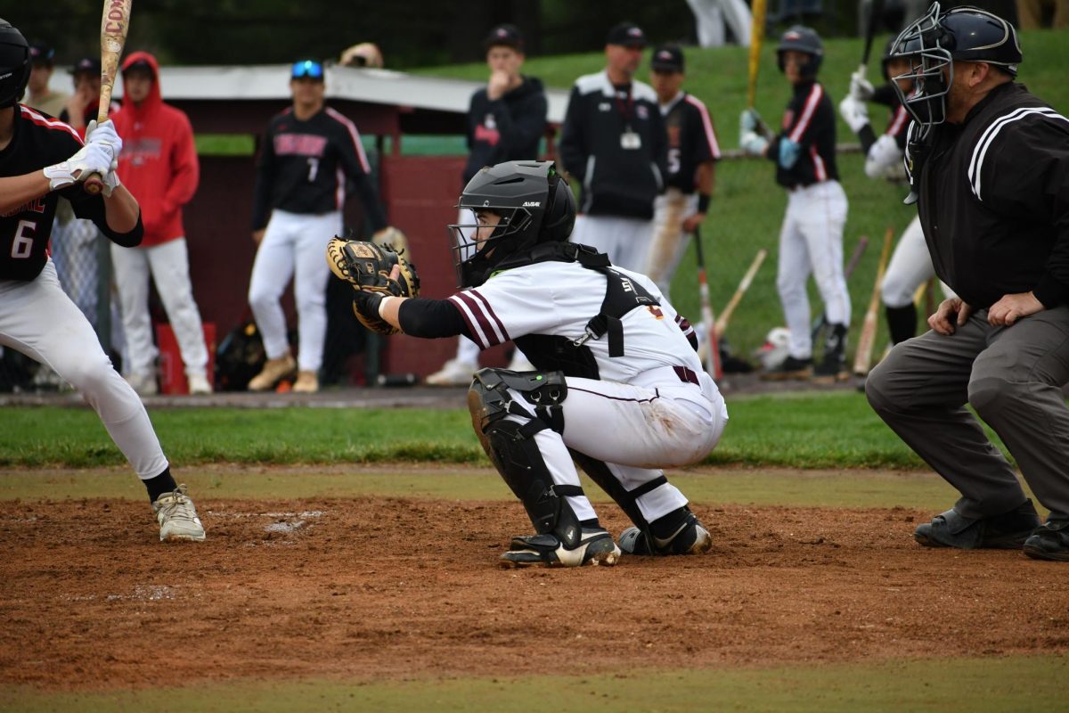 Catcher, LJ Tobery, junior, ready for a pitch.