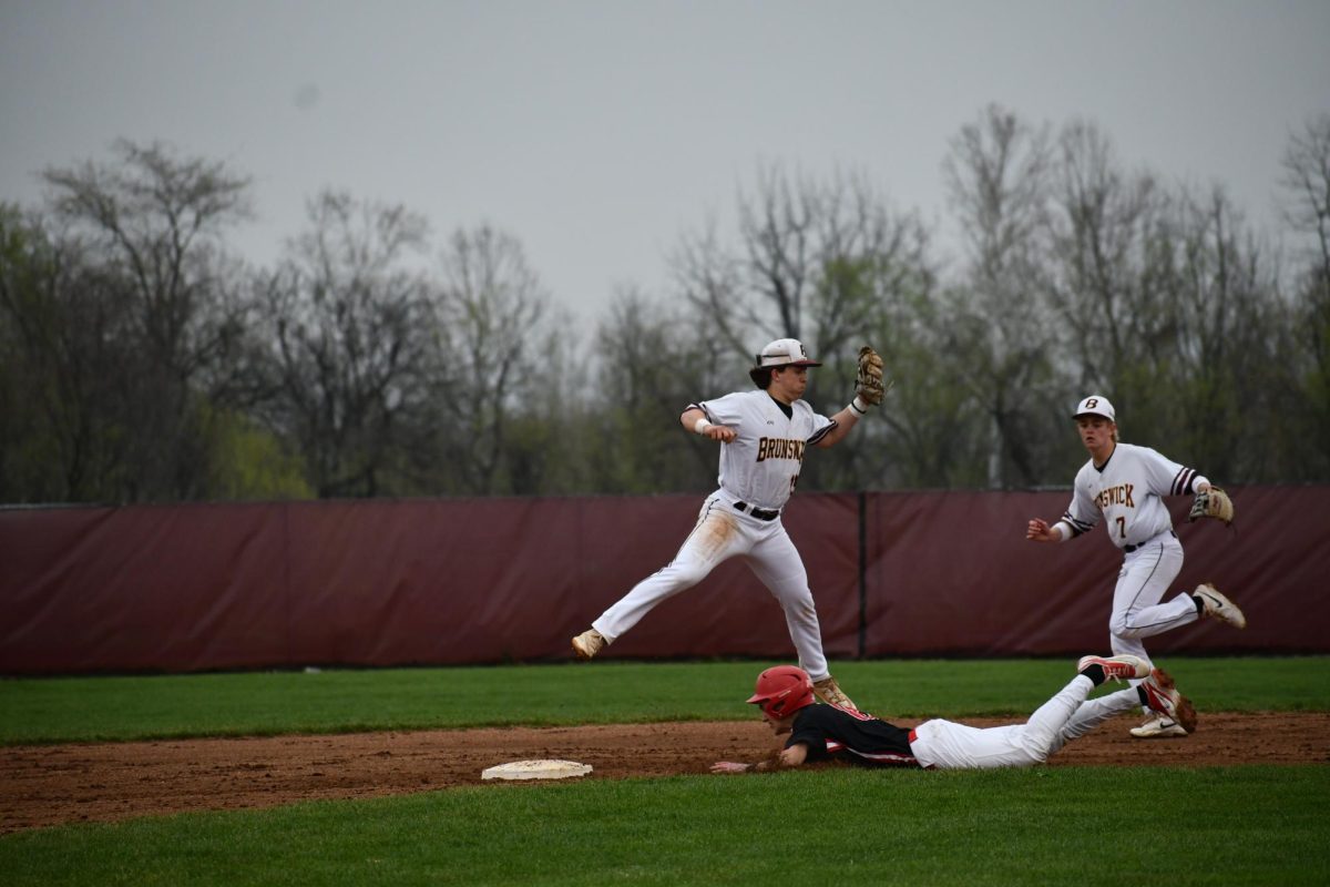 Carter Vinar, junior, catching a ball to get an opponent out.