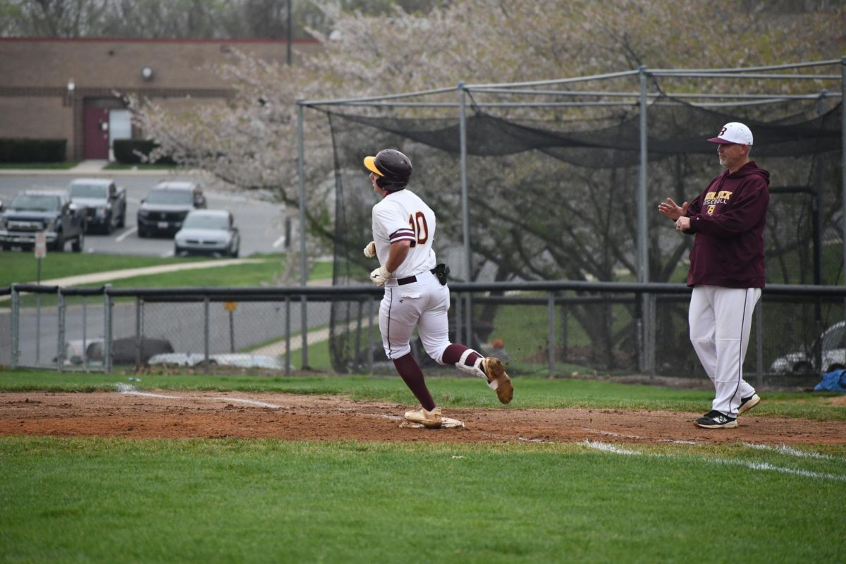 Judah Purks, senior, running past second base.