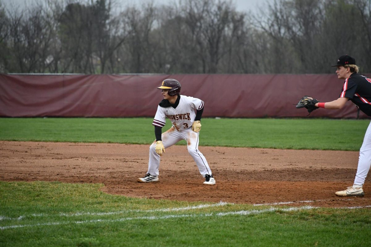 #3, Owen Nugent, sophomore, prepared to run to the next base.