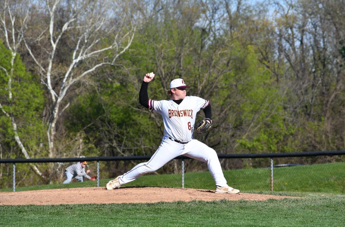 Third baseman, Justin Rickets, senior, throws the ball to home plate.