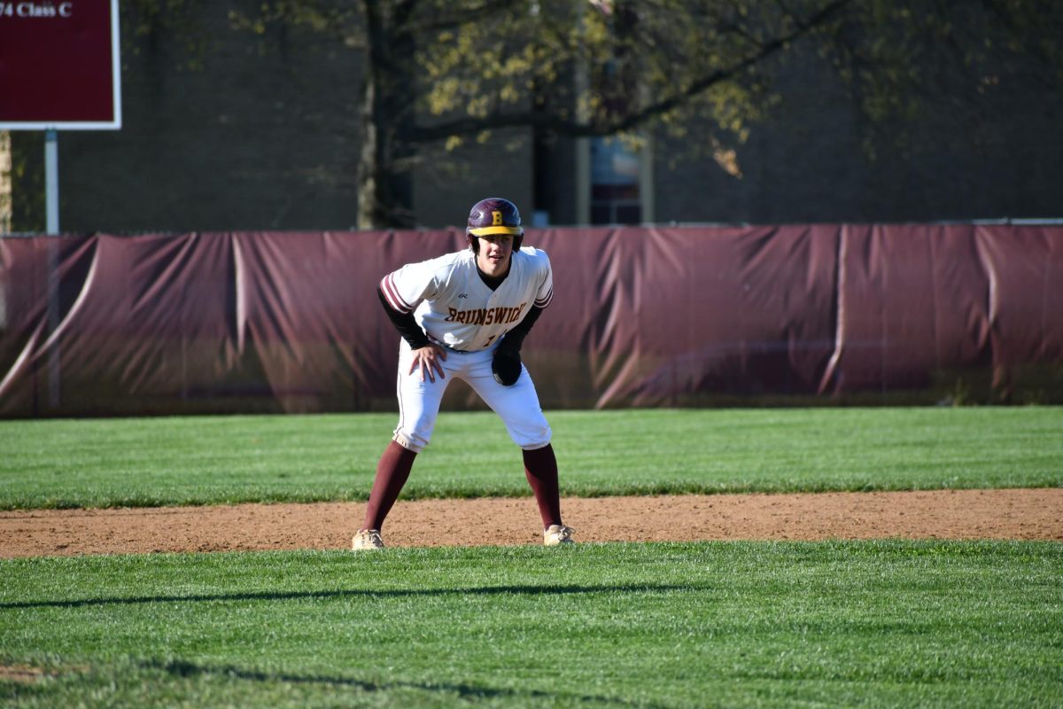 First baseman, Judah Purks, senior, taking his lead at second base after a hit. 