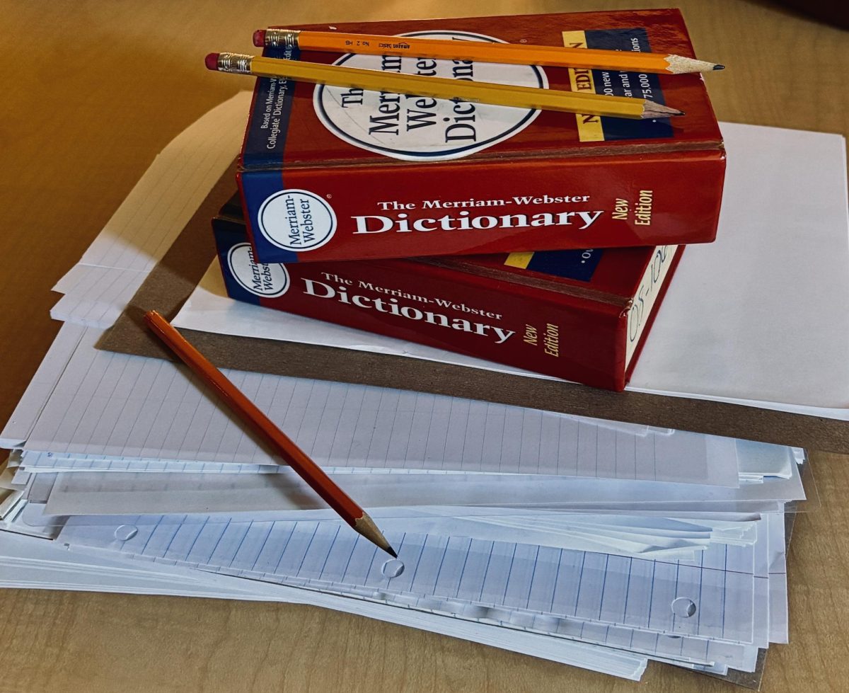 Books and papers stacking on top of each other signifying the importance of studying in today's classes.