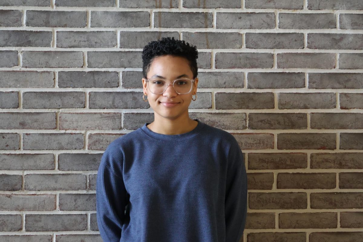 Ramata Sautter, a sophomore at Brunswick High School stands in front of  brick wall.