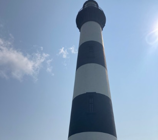 The Bodie island lighthouse stands proudly on a warm summer day.